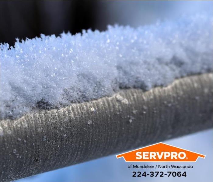 Frost and ice accumulation is a visible sign of frozen pipe damage.
